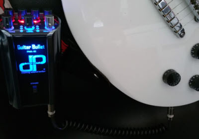 Guitar Bullet PMA-10 clipped to a guitar strap